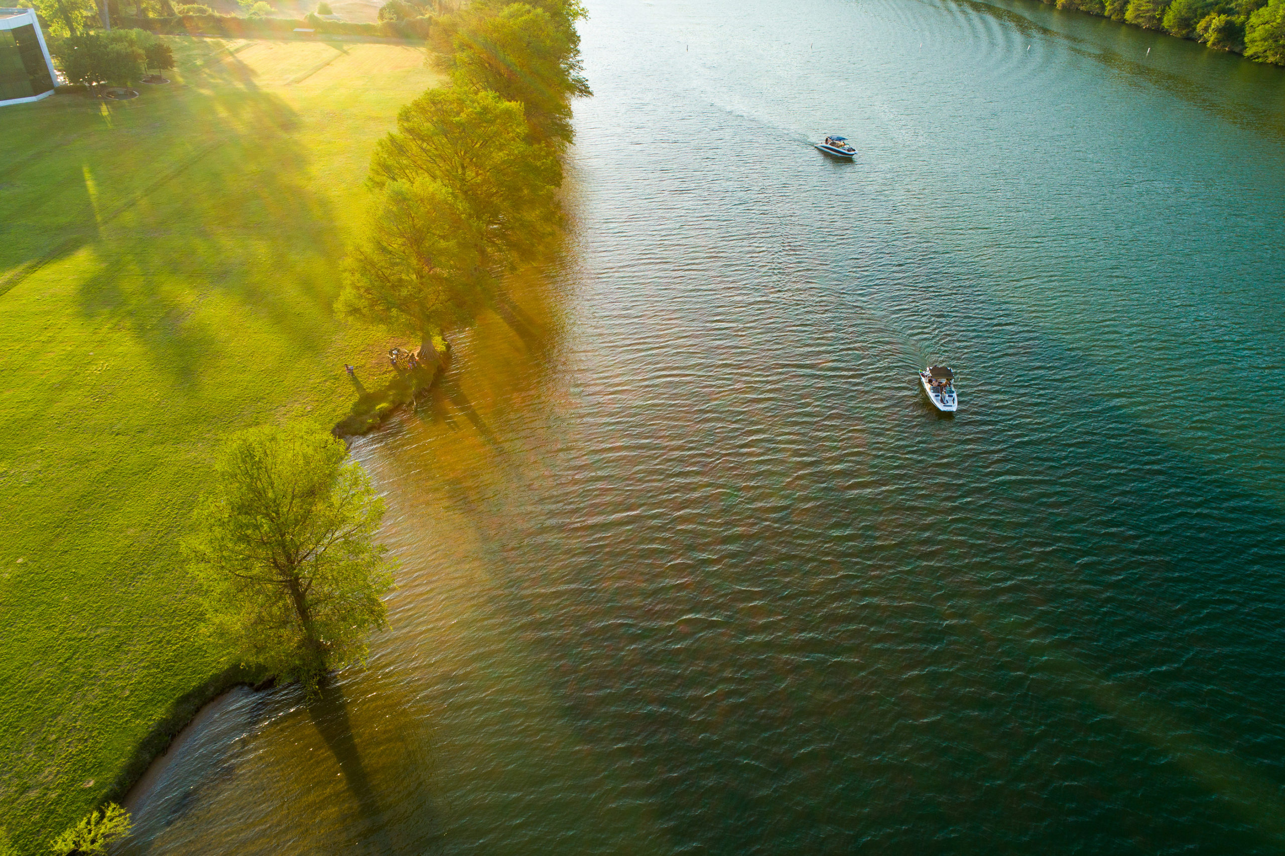 Sunset On The Lake Relaxing Boats And Relaxing Along The Coast O